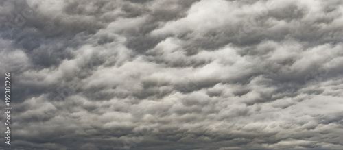 The panorama of overcast texture with clouds. Copy space.A lot of clouds in dramatic filter. © Alex