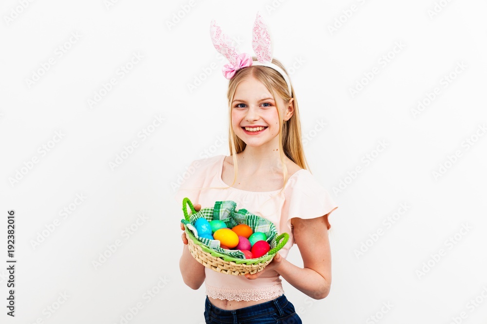 Teenage girl holding Easter eggs Teenage girl holding Easter eggs