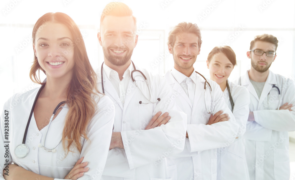 Portrait of medical team standing with arms crossed in hospital Portrait of medical team standing with arms crossed in hospital