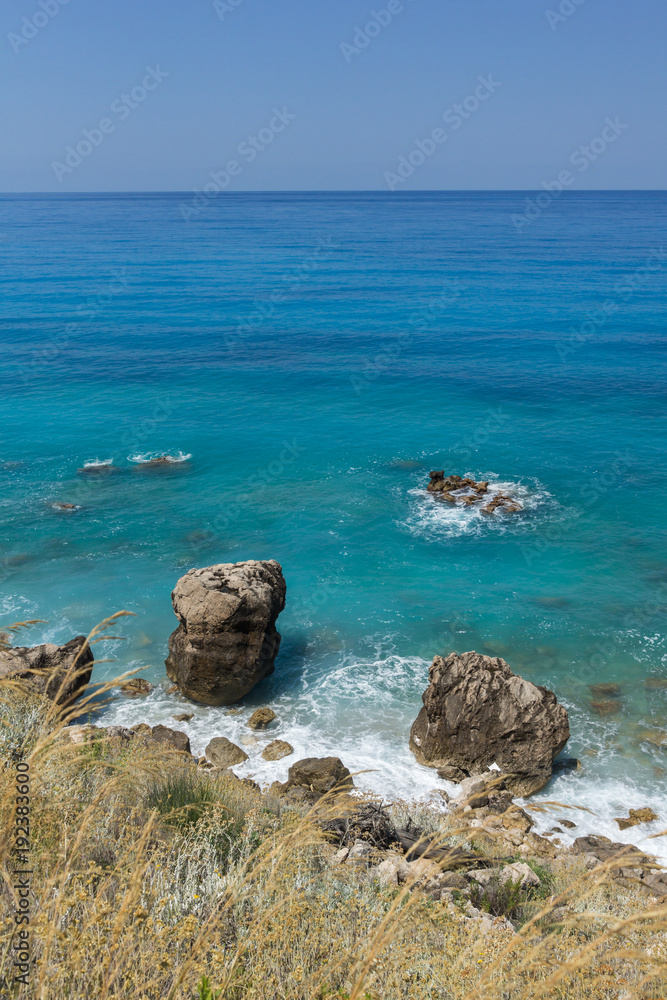 Panoramic view of Agios Nikitas Beach with blue waters, Lefkada, Ionian Islands, Greece Panoramic view of Agios Nikitas Beach with blue waters, Lefkada, Ionian Islands, Greece