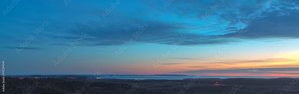 Panorama of land and lake after sunset