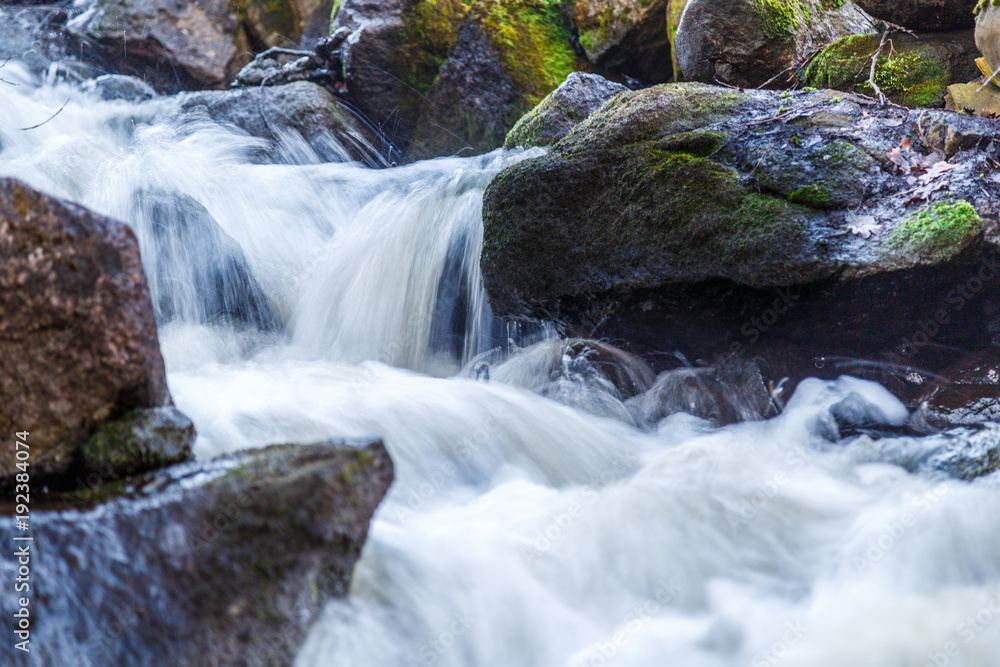 Small waterfall with rocks and moss Small waterfall with rocks and moss