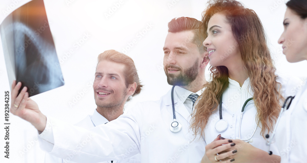 Portrait of young male doctors looking at x-ray Portrait of young male doctors looking at x-ray