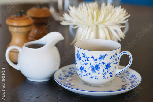 Photography A china tea cup and saucer with a blue and white flower pattern