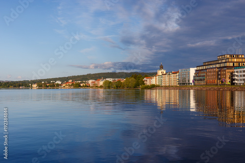 Reflections of a city on a lake