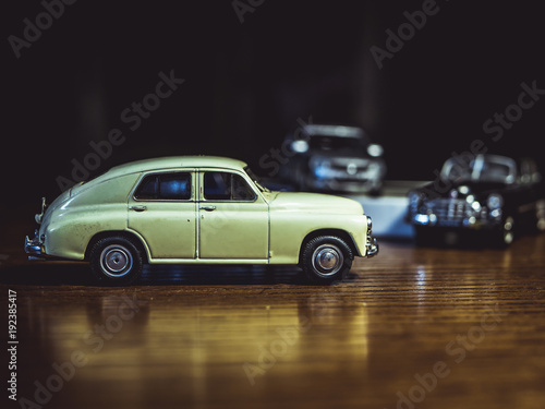 a toy car model on the table isolated black background