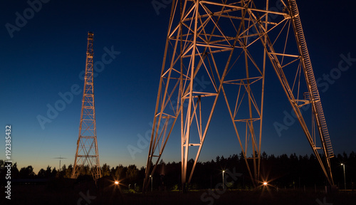 Illuminated radio tower by night