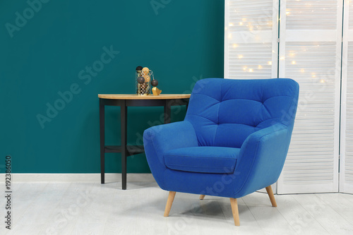 Trendy armchair with table ...
