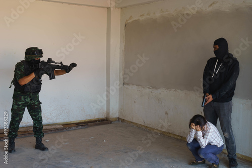 Soldier is trying to rescue female hostage from terrorist.