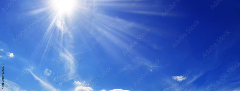Sun and clouds in the blue sky   