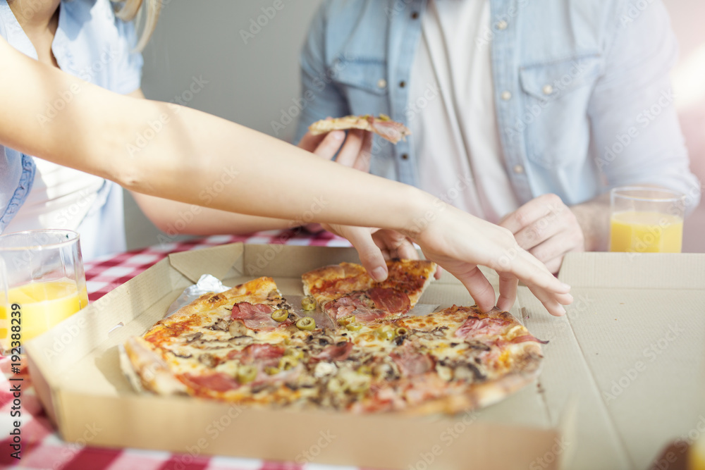 Couple eating pizza Couple eating pizza