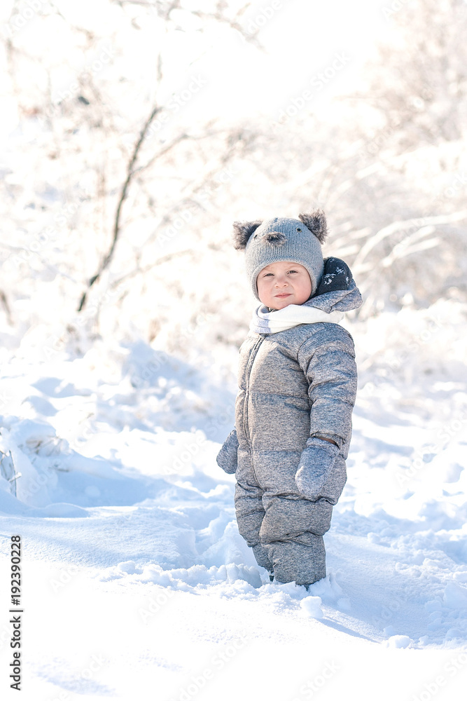 child in the forest in the snow child in the forest in the snow