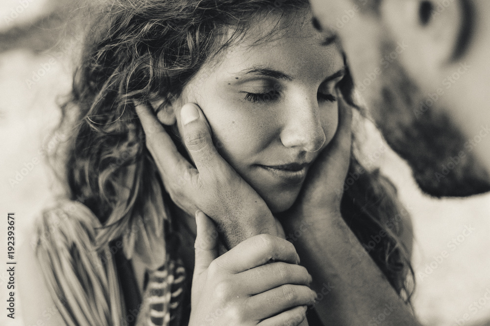 Man holding woman face in his hands before kissing. Love ralationships ...