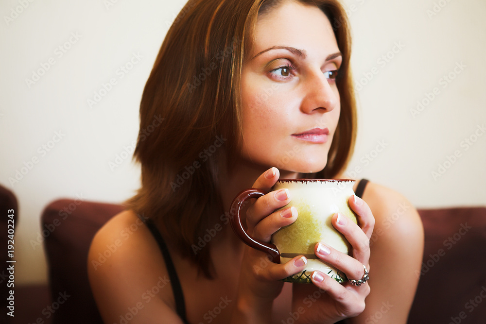 Portrait of young beautiful woman with tea Portrait of young beautiful woman with tea