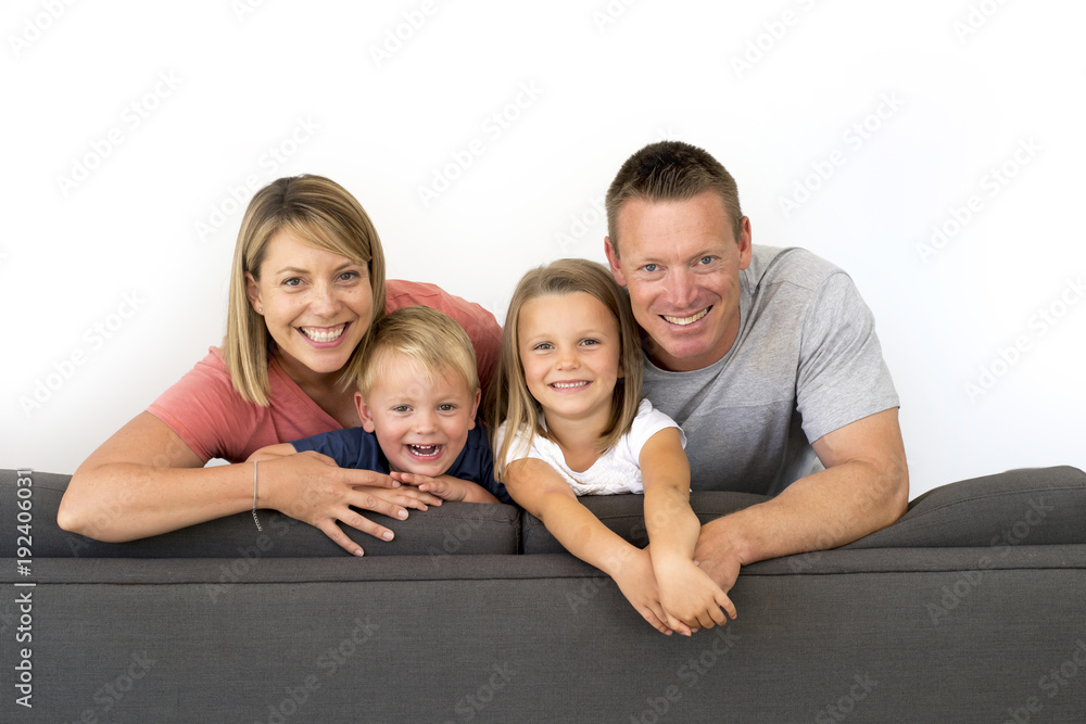 young attractive and happy couple posing sitting at home sofa co young attractive and happy couple posing sitting at home sofa co