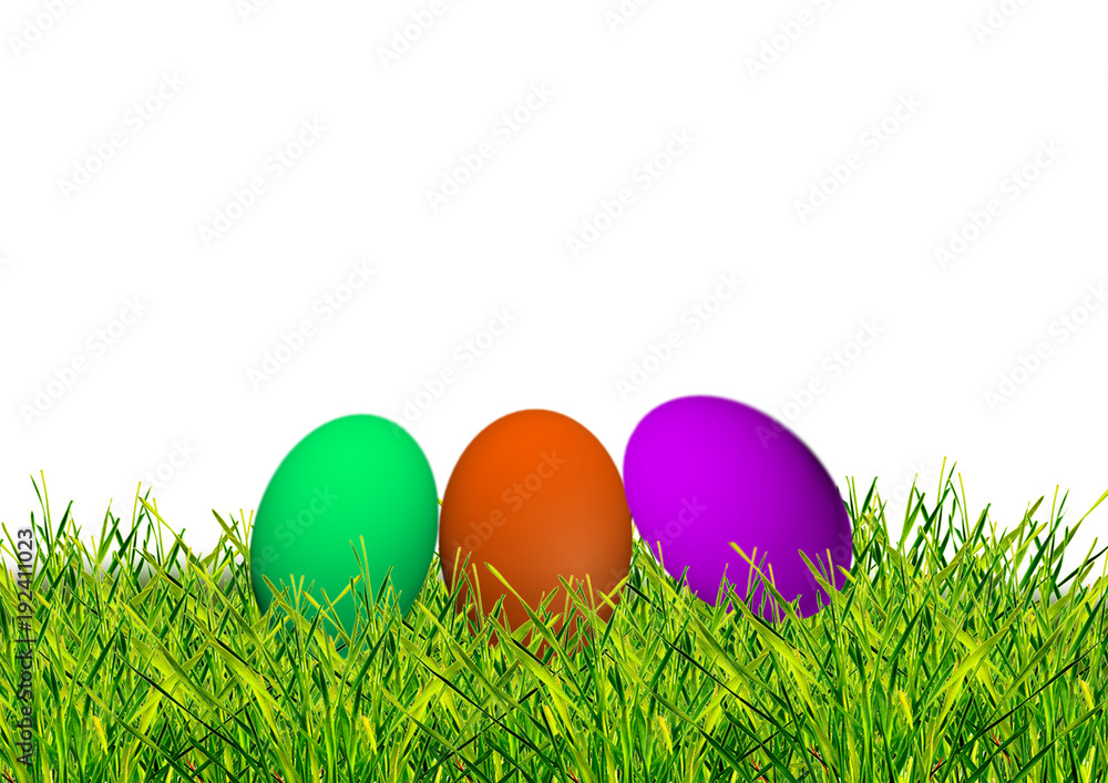 Easter colored eggs on the green grass