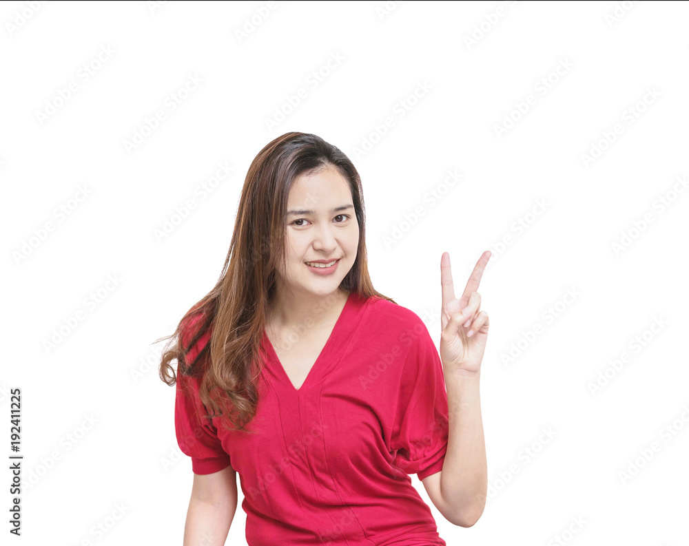 Closeup asian woman holds up two finger motion with smile face isolated on white background with copy space Closeup asian woman holds up two finger motion with smile face isolated on white background with copy space
