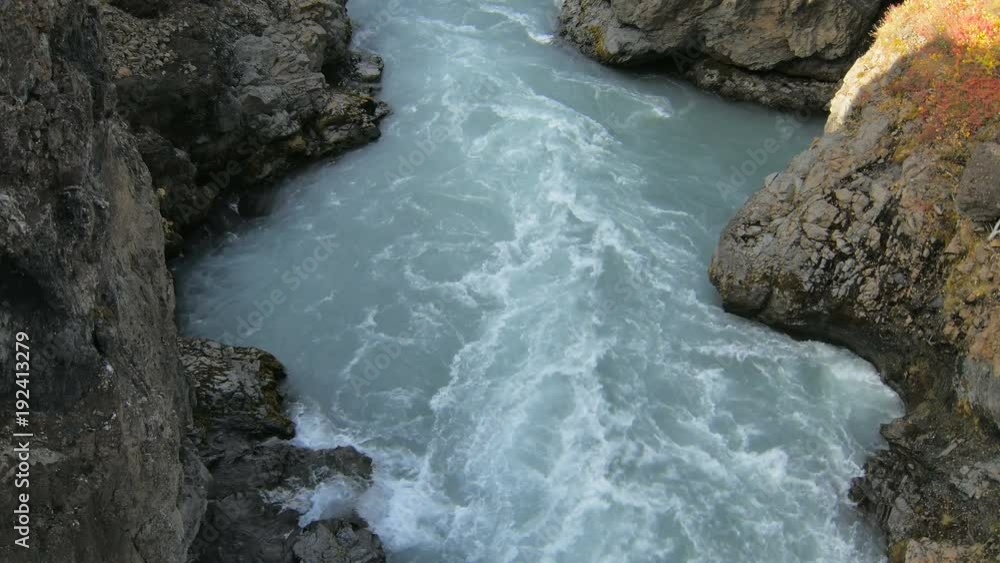rapid mountain river flow between hard black rocks, dramatic shot rapid mountain river flow between hard black rocks, dramatic shot