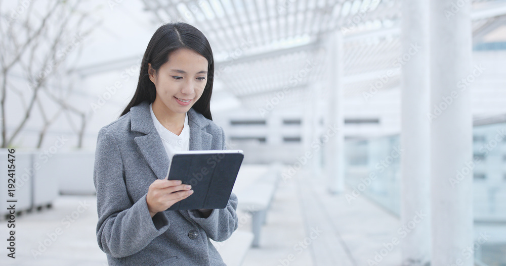 Businesswoman using tablet computer Businesswoman using tablet computer