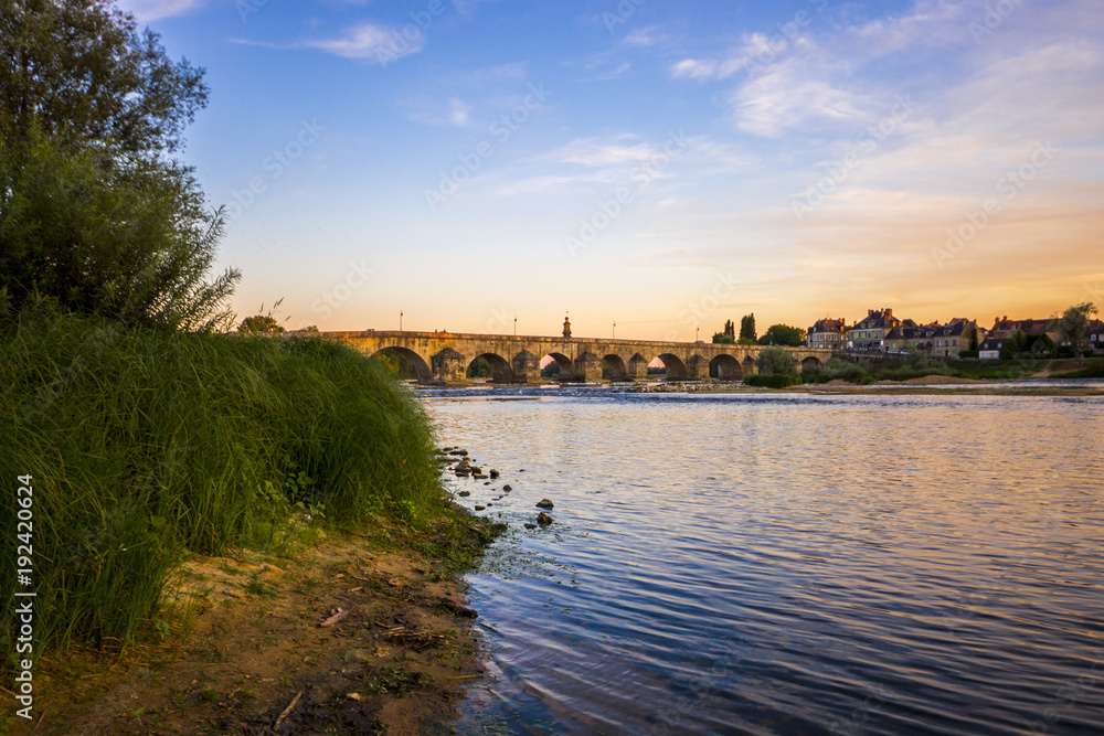 Sunset over the Loire river at La Charité-sur-Loire, Central France, with the Pont La Loire bridge in the background