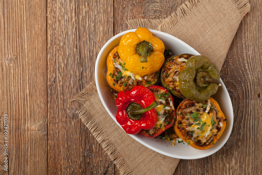 Colorful baked with cheese, stuffed peppers with rice and minced meat. Colorful baked with cheese, stuffed peppers with rice and minced meat.