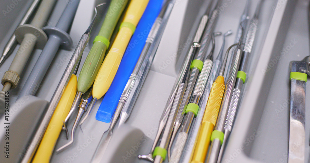Open the dental tool drawer Open the dental tool drawer