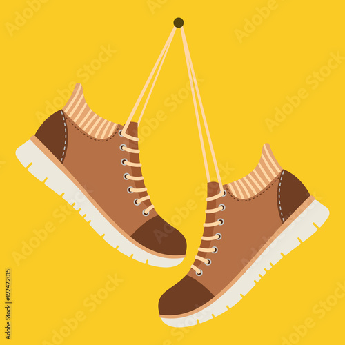 Brown shoes hang on laces