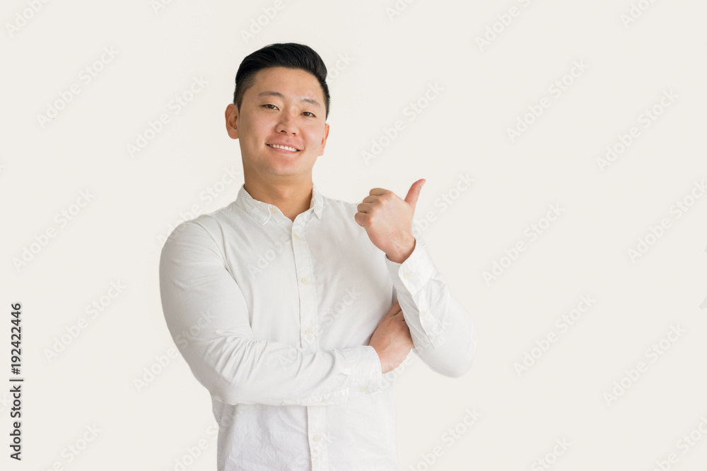 Content successful Asian manager showing thumb-up Content successful Asian manager showing thumb-up