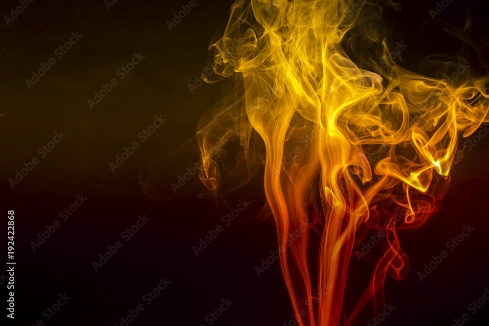Colored smoke on black background Colored smoke on black background