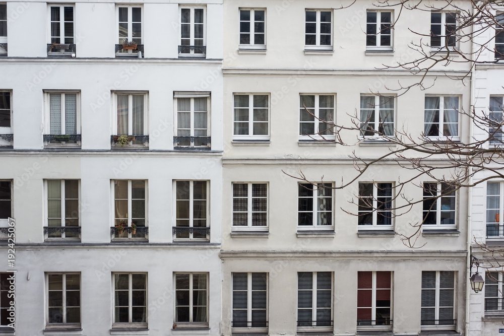 Facade of two big white houses in Paris, France