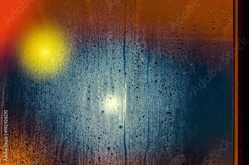 Drops and water stains on the glass on a rainy evening