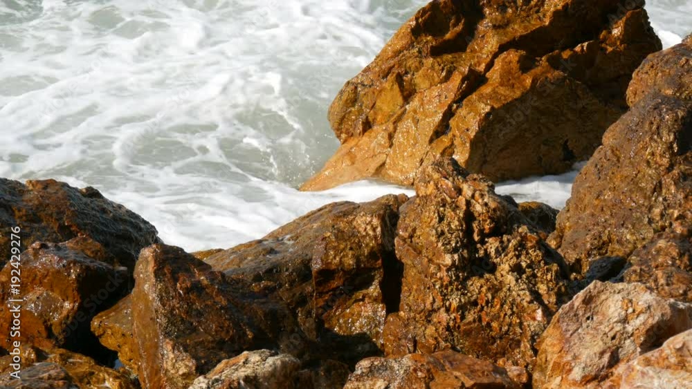 Waves beat against the rocky shore. Beautiful waves of the South China Sea close up view Waves beat against the rocky shore. Beautiful waves of the South China Sea close up view