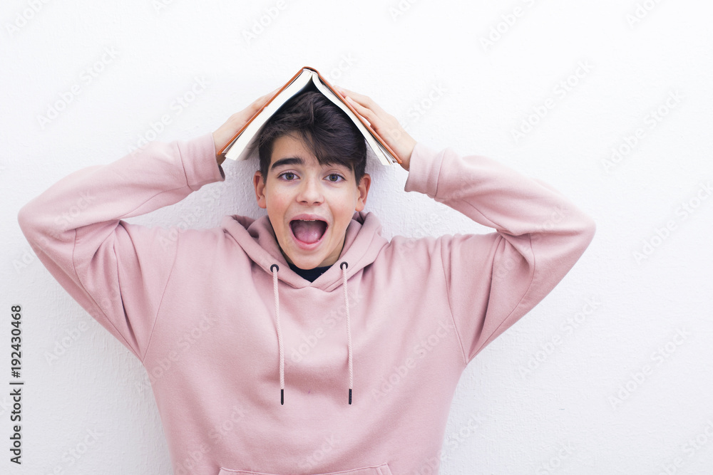 adolescent or preadolescent student with book on white background adolescent or preadolescent student with book on white background