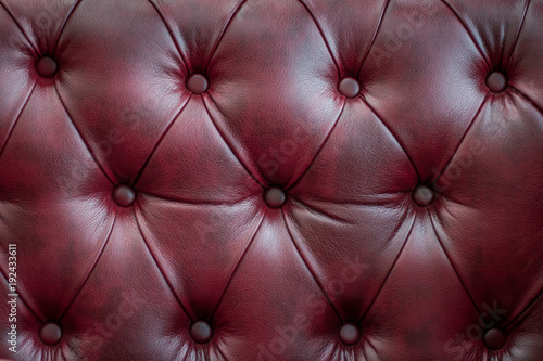 Closeup texture of vintage red leather sofa for background