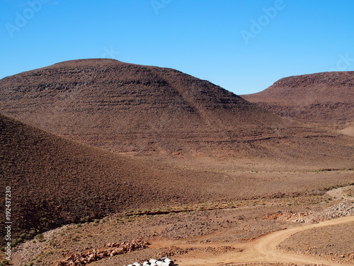 Rocky Atlas Mountains range landscape in southeastern Morocco near old village of Oulad photo