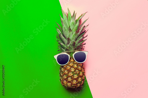 pineapple on colored paper with glasses