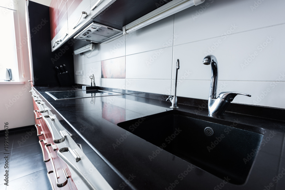 close up view of sink and faucets in kitchen close up view of sink and faucets in kitchen