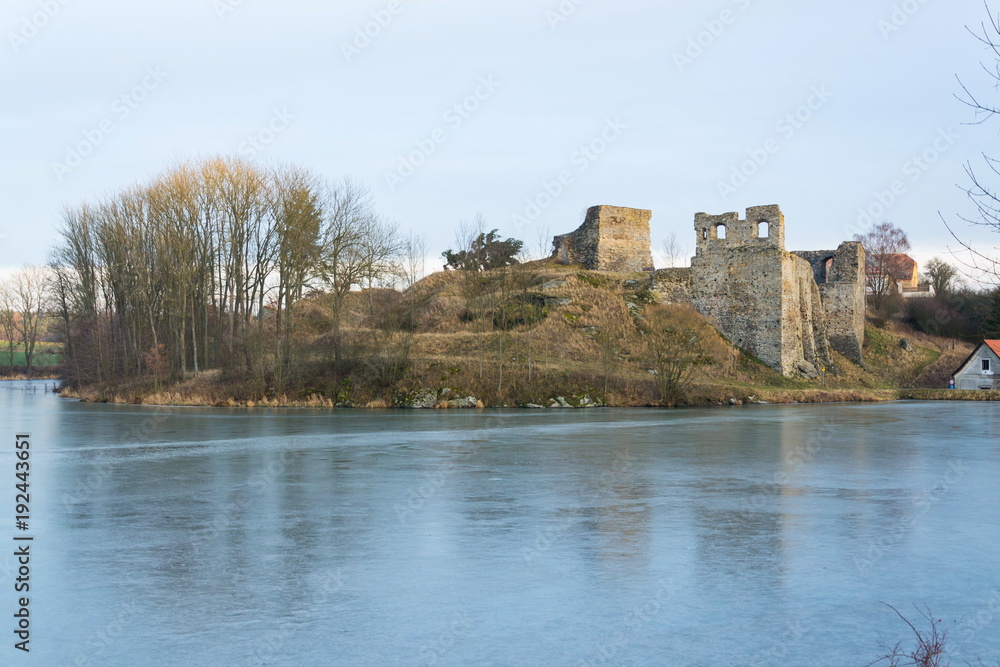 Borotin Castle Ruins with frozen pond in foreground, Czech Republic