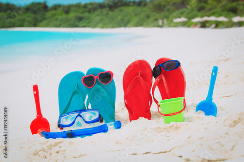 slippers, toys and diving mask at beach
