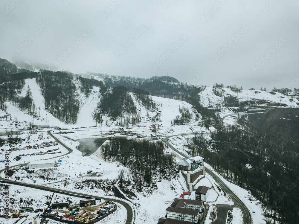 aerial view of the road on a winter snowy day. aerial view of the road on a winter snowy day.