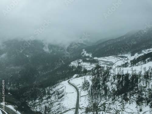 aerial view of the road on a winter snowy day.