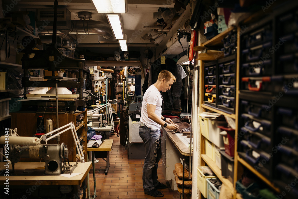 Man in leather workshop Man in leather workshop