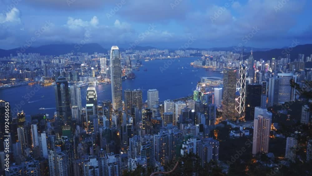 an evening shot of victoria harbour from the peak in hong kong, china an evening shot of victoria harbour from the peak in hong kong, china