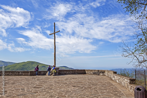 Cross on the cliff of Vern, at an altitude of 1128 meters. The Sanctuary of La Verne. Italy