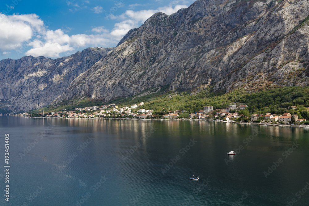 Obraz premium Fishing Boats in Bay by Montenegro Mountains