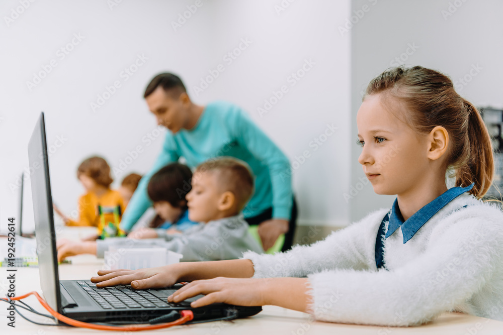 beautiful schoolgirl working with laptop at class, stem education concept beautiful schoolgirl working with laptop at class, stem education concept