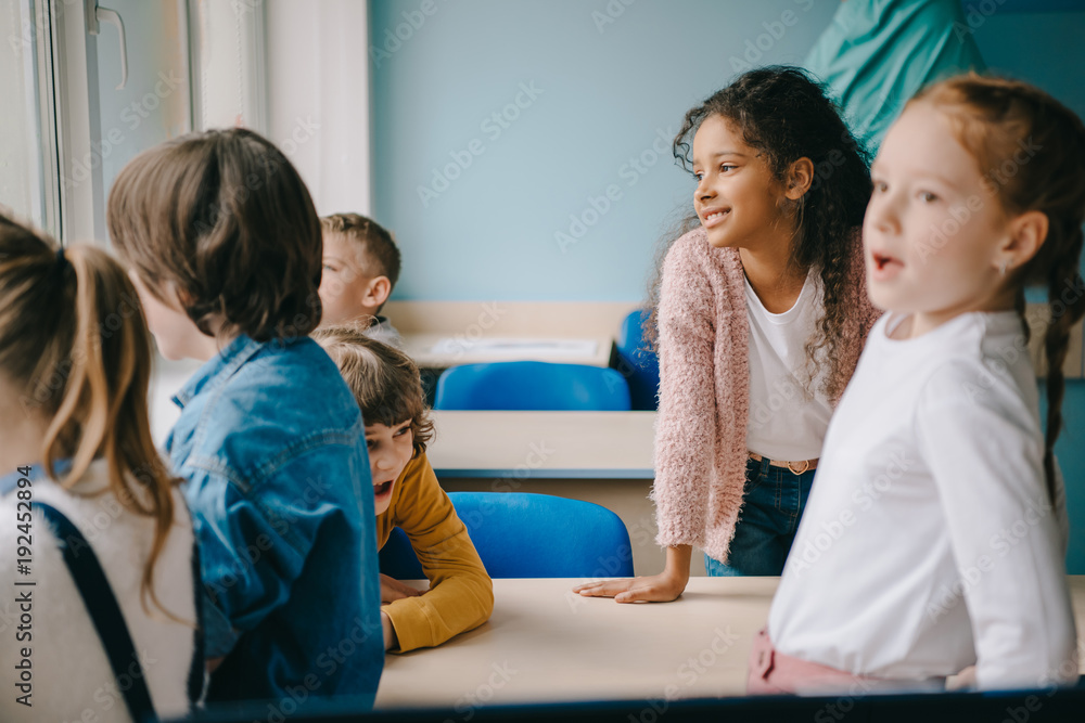 group of kids spending time together at classroom group of kids spending time together at classroom