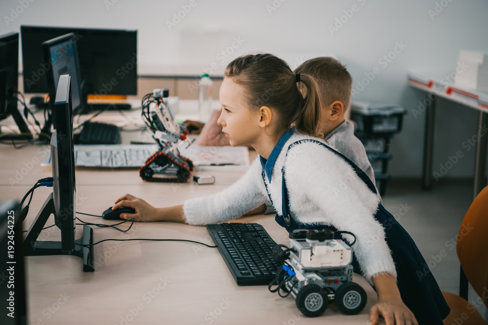 concentrated teen child programming robot at class, stem education concept concentrated teen child programming robot at class, stem education concept