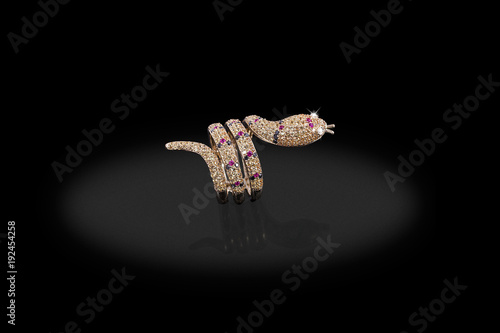 Yellow gold precious ring shake with diamonds on black background.