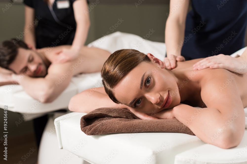Fototapeta premium young couple having massage in spa center